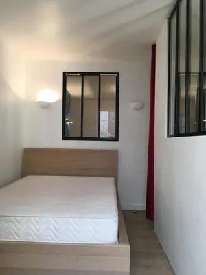 Un ou plusieurs lits dans un hébergement de l'établissement Appartement cosy fond de cour