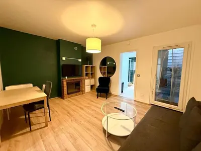 Coin salon dans l'établissement Appartement cosy fond de cour