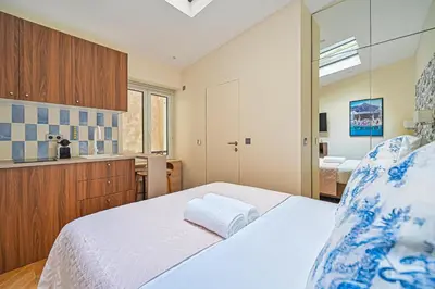 Un ou plusieurs lits dans un hébergement de l'établissement Montparnasse Signature Apartments
