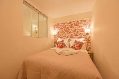 Un ou plusieurs lits dans un hébergement de l'établissement Montparnasse Signature Apartments