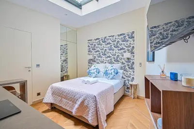 Un ou plusieurs lits dans un hébergement de l'établissement Montparnasse Signature Apartments