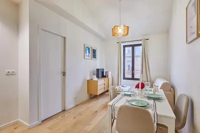 Coin salon dans l'établissement Charming Apartment Boulogne facing Les Passages