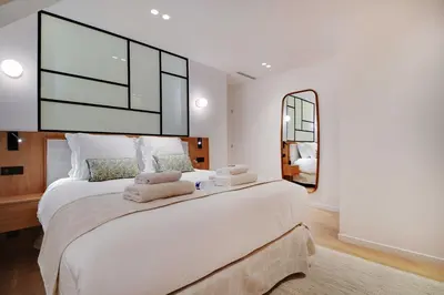 Un ou plusieurs lits dans un hébergement de l'établissement Modern apartment - 2BR 6P - Bonne-Nouvelle