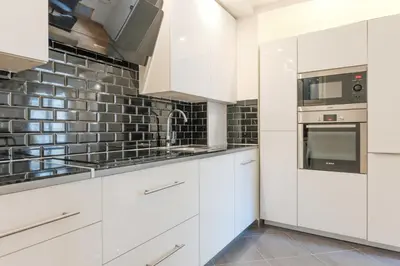 Cuisine ou kitchenette dans l'établissement Comfortable Apartment - 1BR 2P - Arts et Métiers