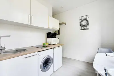 Cuisine ou kitchenette dans l'établissement Amazing Studio in the heart of the Marais