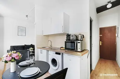 Cuisine ou kitchenette dans l'établissement Cozy apartment - Rue de Bretagne