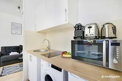 Cuisine ou kitchenette dans l'établissement Cozy apartment - Rue de Bretagne