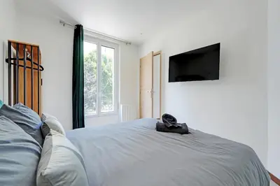 Un ou plusieurs lits dans un hébergement de l'établissement Apartment Suite 14 aux Portes de Paris