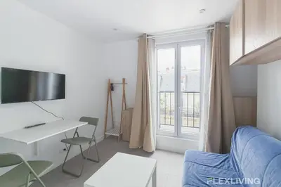 Télévision ou salle de divertissement dans l'établissement Cozy Studio in Paris 10