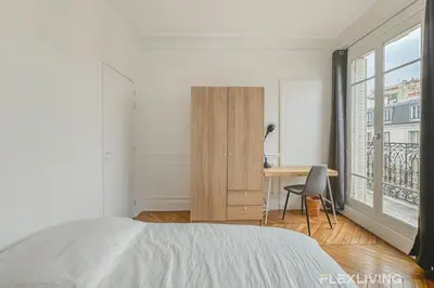 Un ou plusieurs lits dans un hébergement de l'établissement Chambre cosy et charmante à Alésia Paris 14e