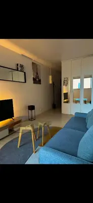 Télévision ou salle de divertissement dans l'établissement Suite vue sur la Tour Eiffel