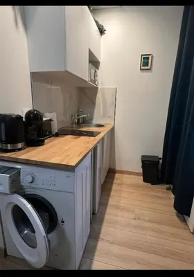 Cuisine ou kitchenette dans l'établissement Studio proche de Tour Eiffel