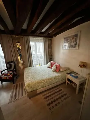 Un ou plusieurs lits dans un hébergement de l'établissement Cosy studio Montorgueil paris centre