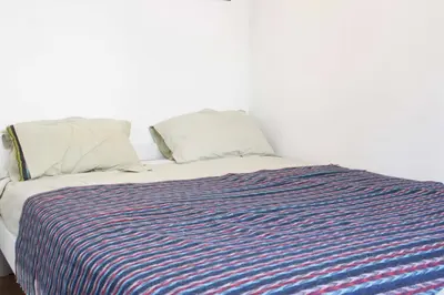 Un ou plusieurs lits dans un hébergement de l'établissement Apartment in the heart of Paris quiet and easy