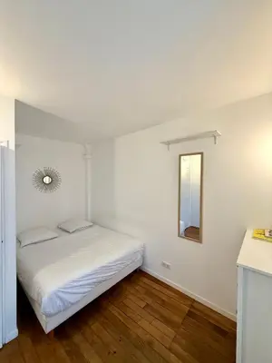 Un ou plusieurs lits dans un hébergement de l'établissement Appartement Bridaine Batignolles Paris