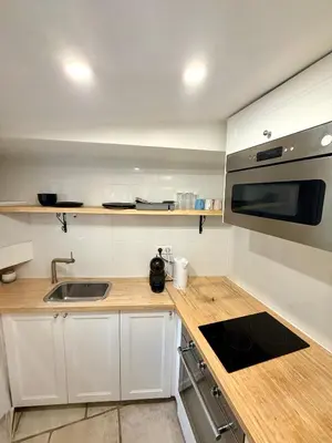 Cuisine ou kitchenette dans l'établissement Appartement Bridaine Batignolles Paris