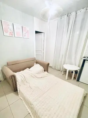Un ou plusieurs lits dans un hébergement de l'établissement Jin's cosy apartment at Paris 10ème