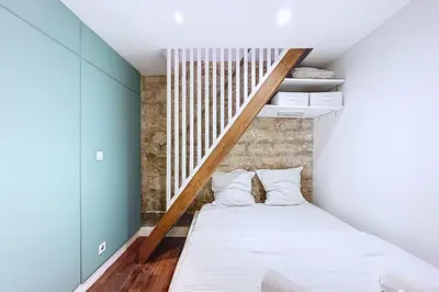 Un ou plusieurs lits dans un hébergement de l'établissement Tiny house près de la Tour Eiffel