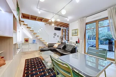 Coin salon dans l'établissement Elegant duplex with garden near the Eiffel Tower