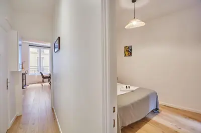 Un ou plusieurs lits dans un hébergement de l'établissement Apartement center of Paris