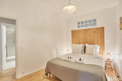 Un ou plusieurs lits dans un hébergement de l'établissement Apartement center of Paris