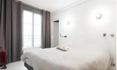 Un ou plusieurs lits dans un hébergement de l'établissement Stylish Montmartre Apartment