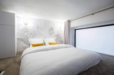 Un ou plusieurs lits dans un hébergement de l'établissement Lemoine Reaumur 2 Cosy Appartement 6P 2BR