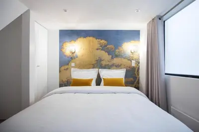 Un ou plusieurs lits dans un hébergement de l'établissement Lemoine Reaumur 2 Cosy Appartement 6P 2BR