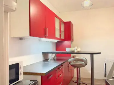 Cuisine ou kitchenette dans l'établissement Aux portes de Paris