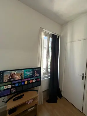 Télévision ou salle de divertissement dans l'établissement Appartement Lumineux, à 5 minutes de Paris
