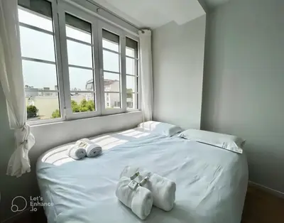 Un ou plusieurs lits dans un hébergement de l'établissement Exceptional apartment near Parc des Princes