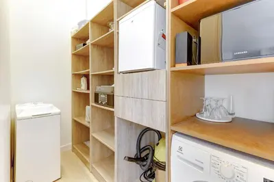Cuisine ou kitchenette dans l'établissement Appartement d'exception a deux pas du Jardin du Luxembourg