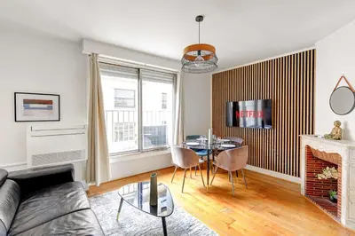Coin salon dans l'établissement Duplex Raffine a deux pas de la Tour Eiffel - Avec A-C