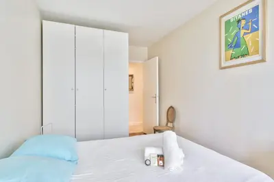 Un ou plusieurs lits dans un hébergement de l'établissement Appartement Iris avec sa terrasse - Welkeys
