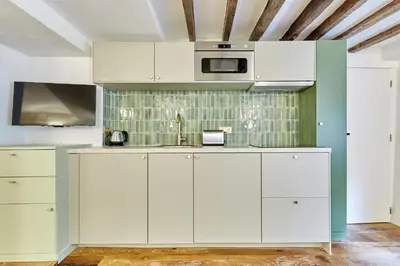 Cuisine ou kitchenette dans l'établissement Residence du passage