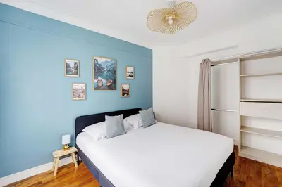 Un ou plusieurs lits dans un hébergement de l'établissement Cozy Apartment 1BR 4P – Villejuif