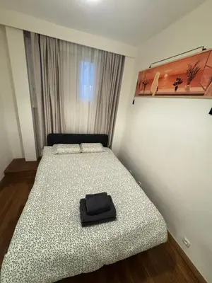 Un ou plusieurs lits dans un hébergement de l'établissement 2-bedrooms apart near Parc des Princes