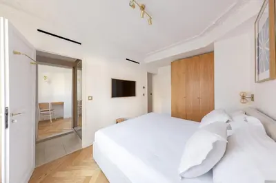 Un ou plusieurs lits dans un hébergement de l'établissement Le Marais - Iconic Penthouse with Balcony