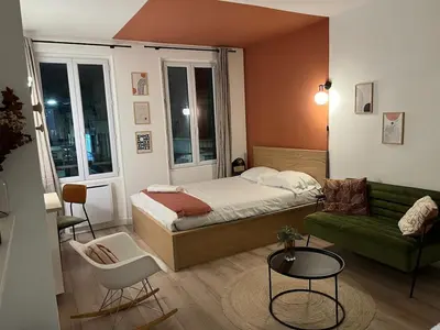 Un ou plusieurs lits dans un hébergement de l'établissement Le studio parisien