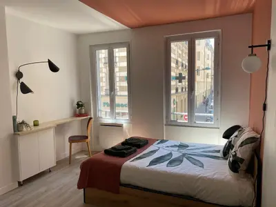 Un ou plusieurs lits dans un hébergement de l'établissement Le studio parisien