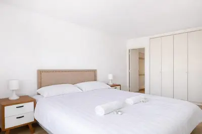Un ou plusieurs lits dans un hébergement de l'établissement Grand Studio 50 m2 Balcon Porte de Versailles