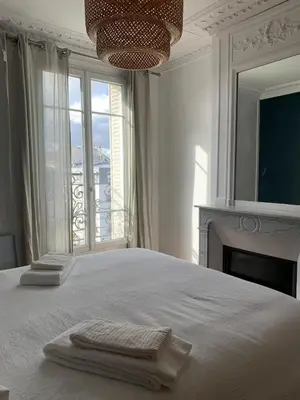 Un ou plusieurs lits dans un hébergement de l'établissement L'Appartement Corentin