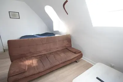 Un ou plusieurs lits dans un hébergement de l'établissement Top floor studio & view - La Fayette / Opéra