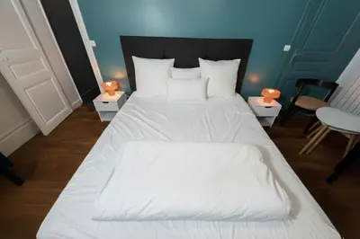 Un ou plusieurs lits dans un hébergement de l'établissement Bright and Cozy Paris Stay