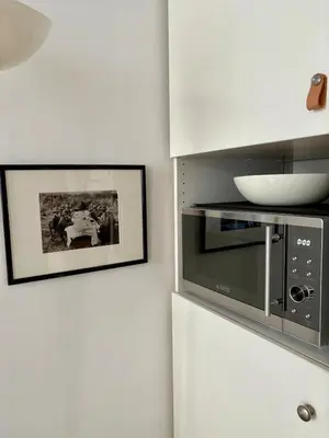 Cuisine ou kitchenette dans l'établissement Charming apartment Trocadéro Eiffel Tower