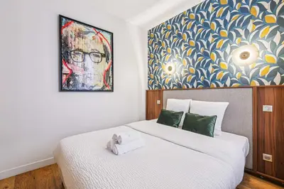 Un ou plusieurs lits dans un hébergement de l'établissement Appartement Central - 4BR 10P - Proche du Louvre