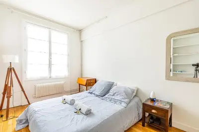 Un ou plusieurs lits dans un hébergement de l'établissement GuestReady - Homely near Montparnasse Tower