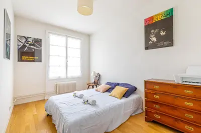 Un ou plusieurs lits dans un hébergement de l'établissement GuestReady - Homely near Montparnasse Tower