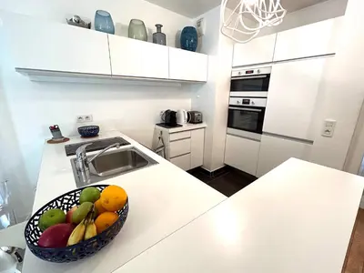 Cuisine ou kitchenette dans l'établissement L'appartement Grenelle