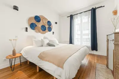 Un ou plusieurs lits dans un hébergement de l'établissement Square Danton Two Bedrooms 5 people
